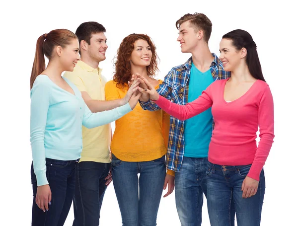 Smiling teenagers making high five — Stock Photo, Image