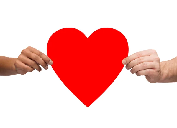 Couple hands holding red heart — Stock Photo, Image