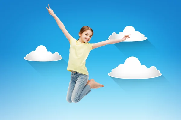 Smiling little girl jumping — Stock Photo, Image