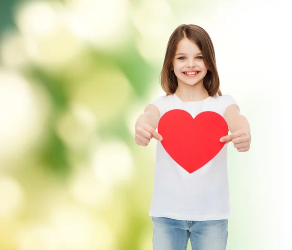 Beautiful little girl sitting at table — Stock Photo, Image