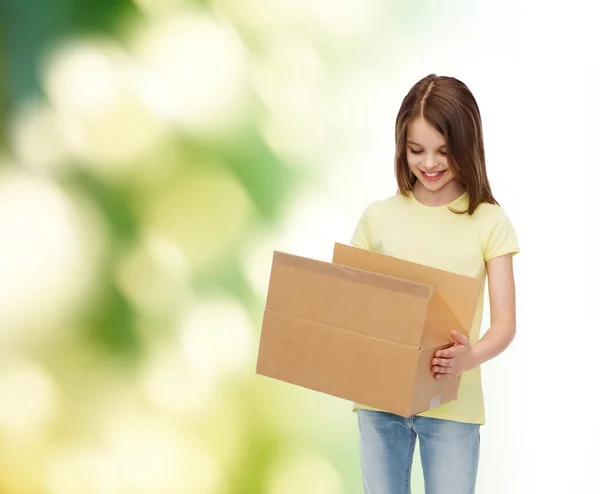 Smiling little girl in white blank t-shirt — Stock Photo, Image