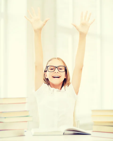 Girl with books and hands up — Stock Photo, Image