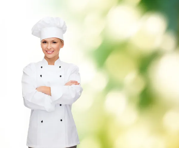 Smiling female chef with crossed arms — Stock Photo, Image