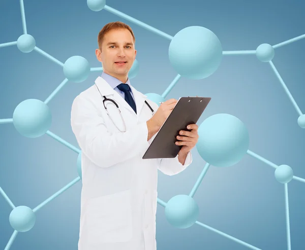 Smiling male doctor with clipboard and stethoscope — Stock Photo, Image