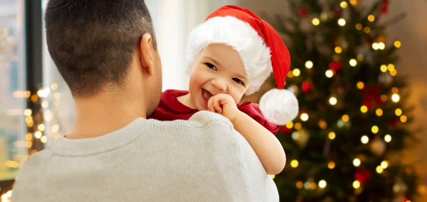 Happy father and baby girl over christmas tree — Stock Photo, Image