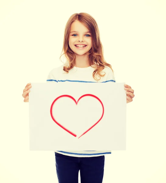 Smiling little child holding picture of heart — Stock Photo, Image