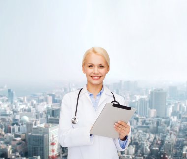 female doctor with stethoscope and tablet pc clipart