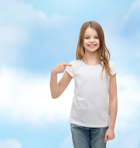 Smiling little girl in blank white t-shirt — Stock Photo, Image