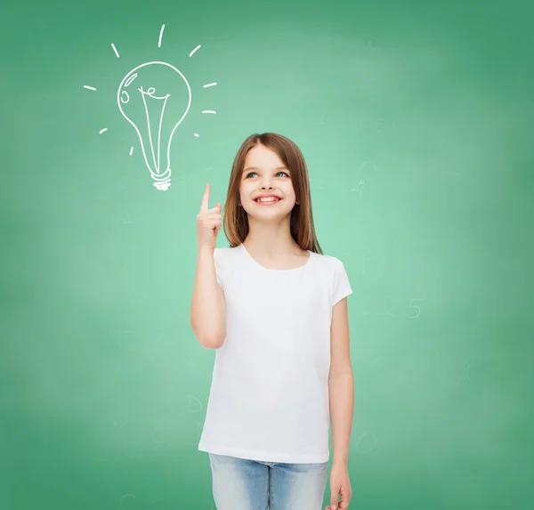 Smiling little girl in white blank t-shirt — Stock Photo, Image