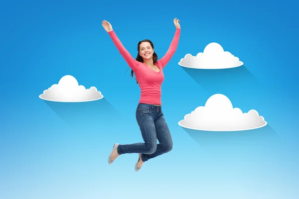 Sonriente joven mujer saltando en el aire —  Fotos de Stock