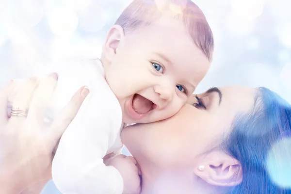 Happy mother kissing baby — Stock Photo, Image