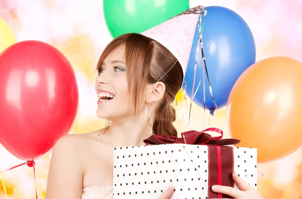 Party girl with balloons and gift box Stock Picture