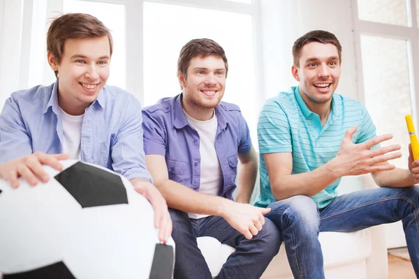 Happy male friends with vuvuzela — Stock Photo, Image