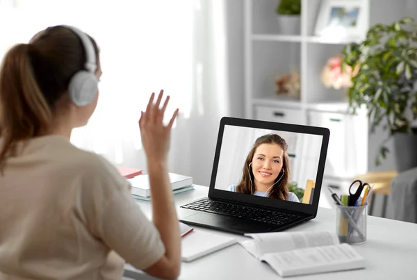 Student with laptop having video call with teacher — Stock Photo, Image