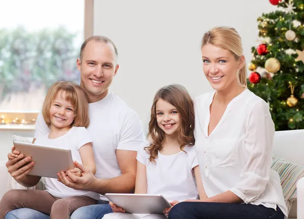 Happy family with tablet pc at home on christmas — Stock Photo, Image