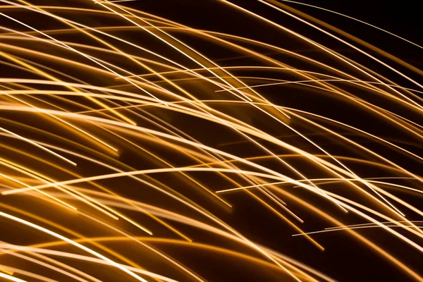 Efecto de luz eléctrica dorada sobre fondo oscuro —  Fotos de Stock