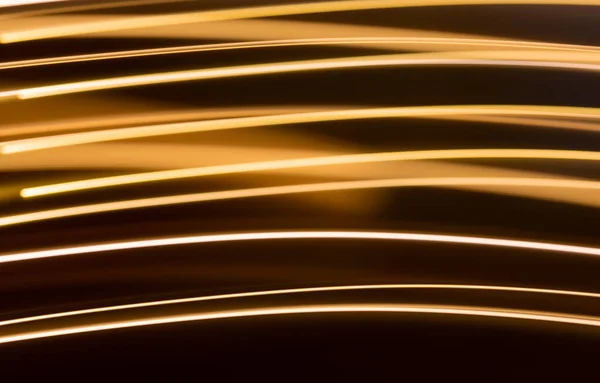 Golden electric light effect on dark background — Stock Photo, Image