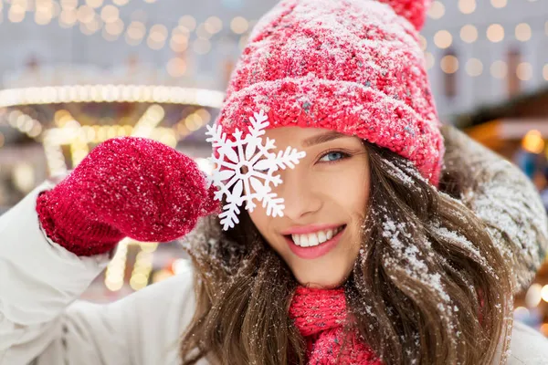 Portrait of teenage girl with snowflake in winter — Stock Photo, Image