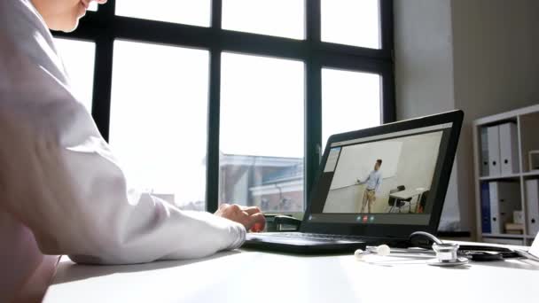 Doctor has video conference on laptop at hospital — Stock Video