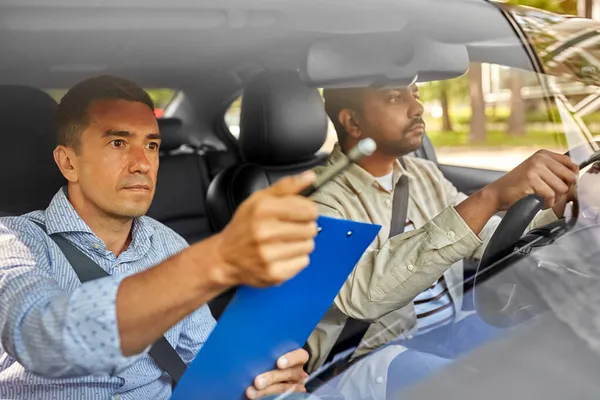 car driving school instructor and young driver