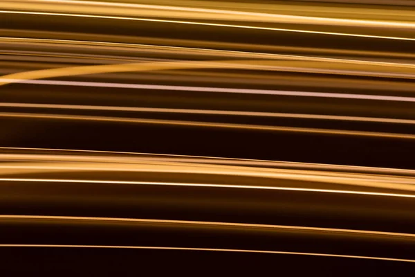 Efecto de luz eléctrica dorada sobre fondo oscuro — Foto de Stock