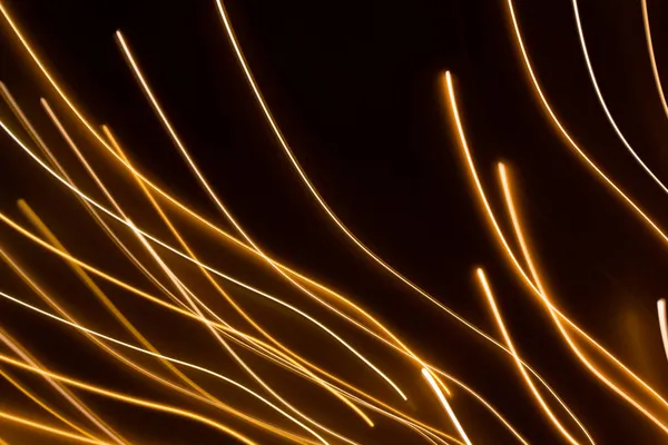 Efecto de luz eléctrica dorada sobre fondo oscuro —  Fotos de Stock