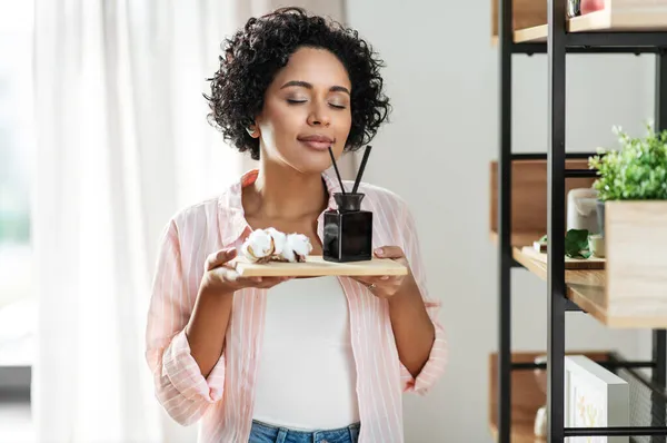 Woman with aroma reed diffuser and cotton at home — Stock Photo, Image