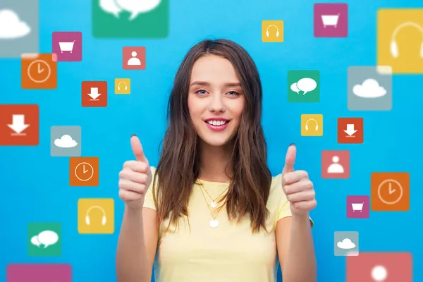 Mujer joven mostrando pulgares hacia arriba sobre iconos virtuales —  Fotos de Stock