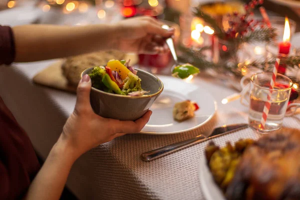 Female hands with food at christmas dinner — Stock Photo, Image