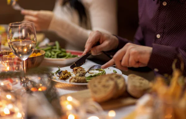 Close up of man eating at christmas dinner at home — Stock Photo, Image