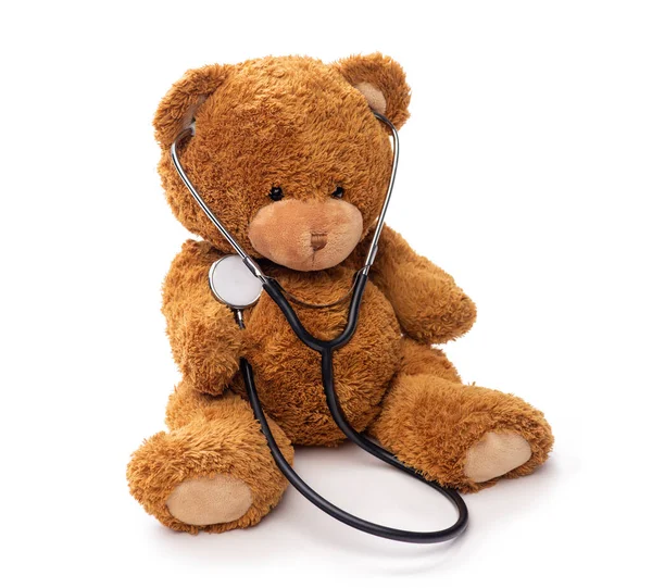 Medvídek se stetoskopem na bílém pozadí — Stock fotografie