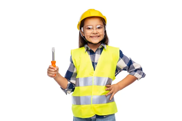Dziewczyna w kasku i kamizelce bezpieczeństwa z śrubokrętem — Zdjęcie stockowe