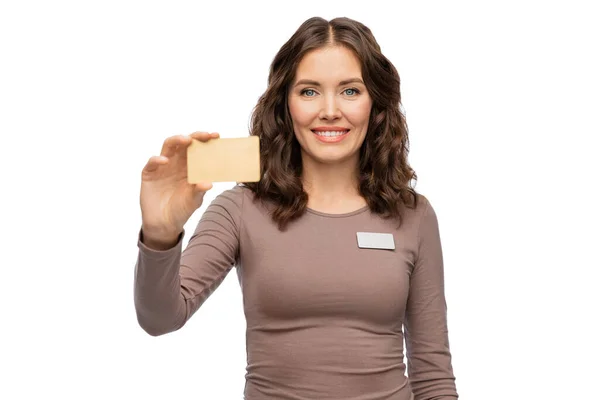 Happy female shop assistant with credit card — Stock Photo, Image