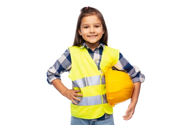 Menina com capacete de construção e colete de segurança — Fotografia de Stock