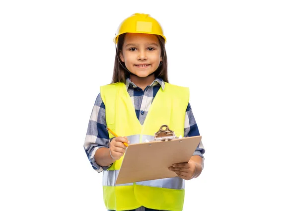 Niña en casco de construcción con portapapeles — Foto de Stock