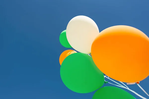 Close up of helium balloons over blue sky — Stock Photo, Image