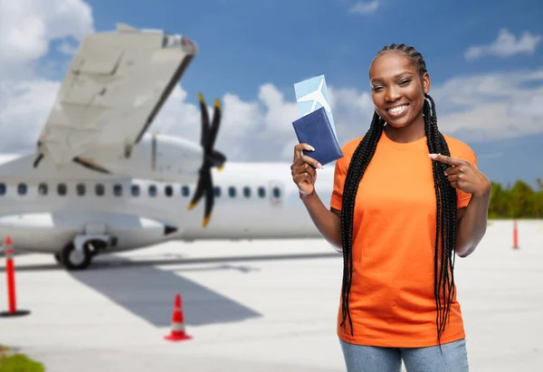 Happy woman with air ticket and immunity passport — Stock Photo, Image