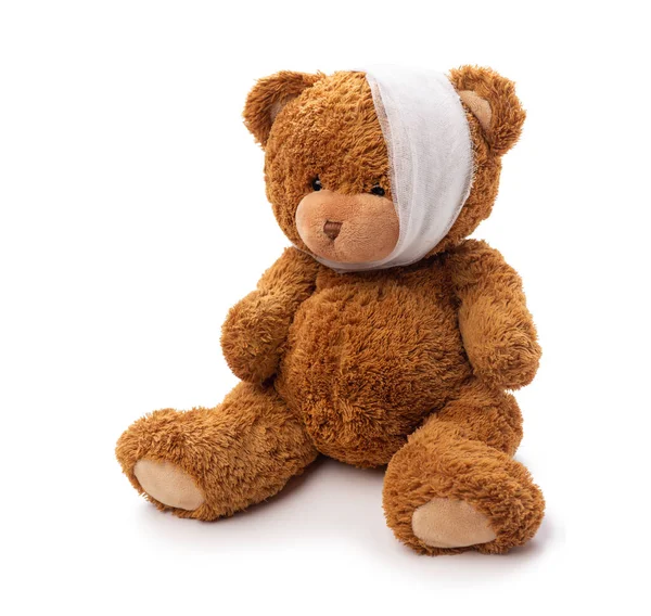 Teddy bear toy with bandaged head having toothache — Stock Photo, Image