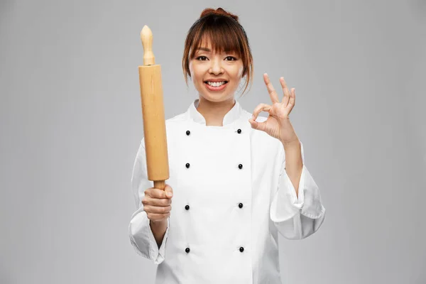 Female chef or baker with rolling pin showing ok — 图库照片