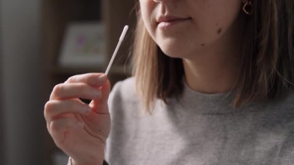 Woman making self testing coronavirus test at home — Vídeo de Stock