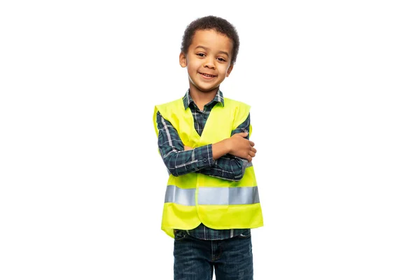 Little boy in safety vest with crossed arms — 图库照片