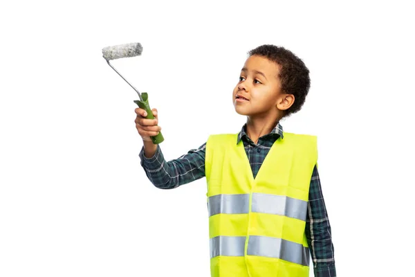 Little boy in safety vest with paint roller — Fotografie, imagine de stoc