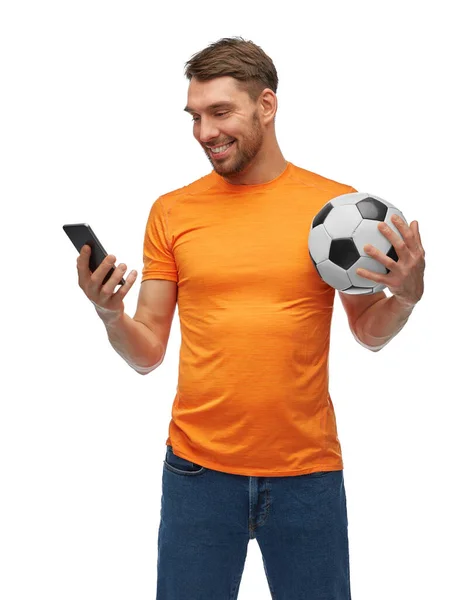 Male football fan with smartphone and soccer ball — Stock Photo, Image