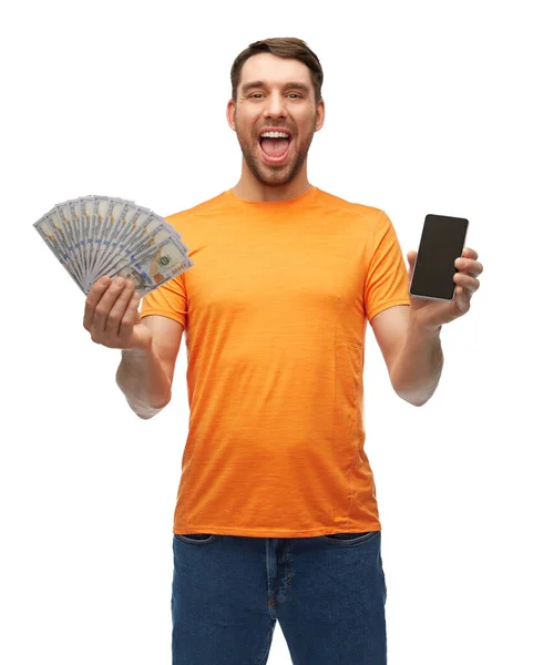 Boldog nevető ember gazdaság okostelefon és pénz — Stock Fotó