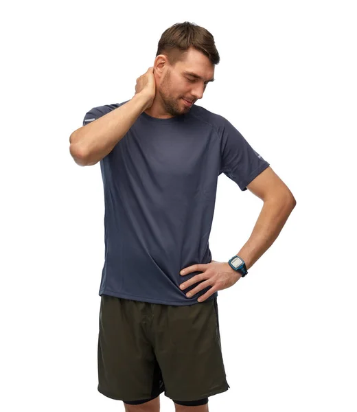 Muž s fitness tracker drží k bolesti krku — Stock fotografie