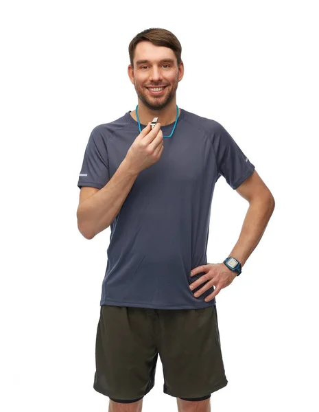 Smiling male trainer or referee with whistle — Foto de Stock