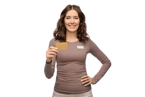 Happy female shop assistant with credit card — Stock Photo, Image