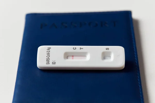 Negative coronavirus test and passport on white — Stock Photo, Image