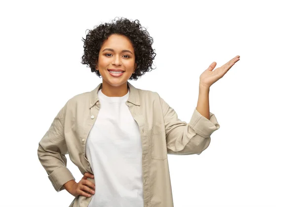 Happy smiling woman holding something on her hand — Stock Photo, Image