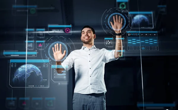 Businessman with virtual projections on screen — Stock Photo, Image